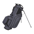 A gray Titleist Hybrid 14 Golf Bag by Titleist, featuring a 14-way top divider, multiple zippered pockets, dual shoulder straps, and two support legs, is displayed on a white background.