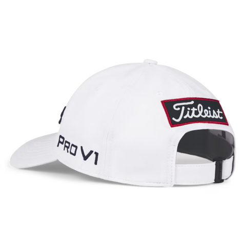 The Titleist Junior Tour Performance Cap is a white kids golf hat with a curved brim, red-bordered Titleist patch above the adjustable strap, and PRO V1 stitched in black on the side—perfect for young golfers.