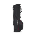 The Titleist Players 4 Carbon Stand Bag 2025 in black with red accents and a white logo features carbon fiber legs, a shoulder strap, and multiple pockets, standing upright on a white background.