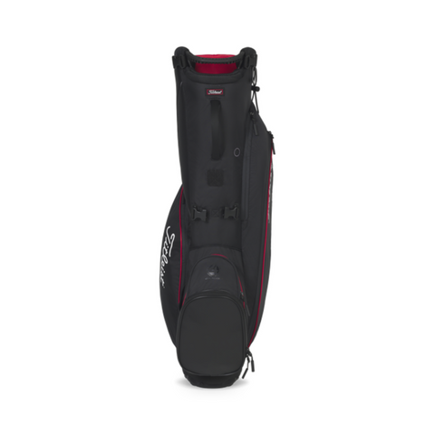 The Titleist Players 4 Carbon Stand Bag 2025 is a black, ultra-lightweight golf bag with red accents, carbon fiber legs, multiple zippered compartments, a top carrying handle, and a white Titleist logo on the side.