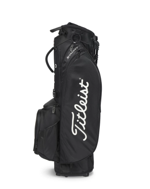 The black Titleist Players 5 StaDry Stand Bag stands upright with the white Titleist logo on its side, multiple pockets, and a lightweight, waterproof design for all-weather play.