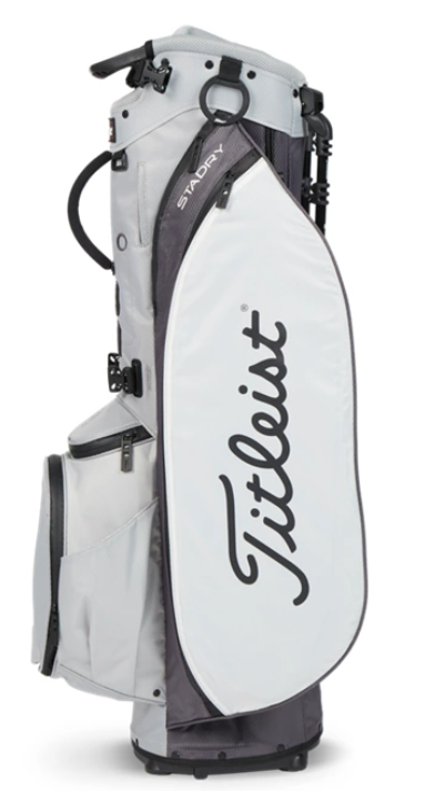 The Titleist Players 5 StaDry Stand Bag is a lightweight, waterproof golf bag in white and gray, featuring multiple zippered pockets and a bold Titleist logo—perfect for any golfer.
