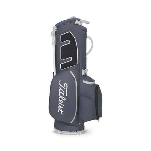 The Titleist Players 5 Stand Bag, in gray and black with white accents, stands upright. This premium golf bag by Titleist features multiple pockets and the prominent Titleist logo on the side.