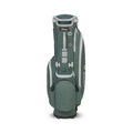 The Titleist Players 5 Stand Bag, shown standing upright in green and white, features multiple zippered pockets and a sturdy base—a premium golf bag from Titleist for golfers seeking quality and style.