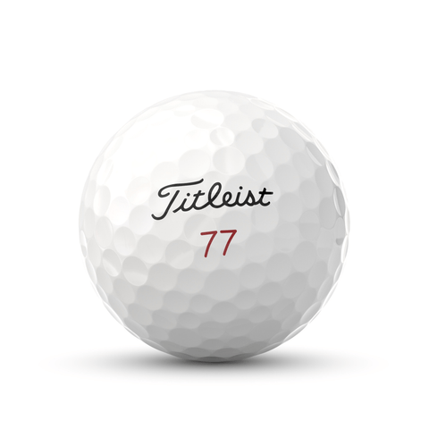A white, dimpled Titleist Pro V1x Special Play Dozen golf ball from a prior generation features the Titleist name in black script and a red number 77 below it.