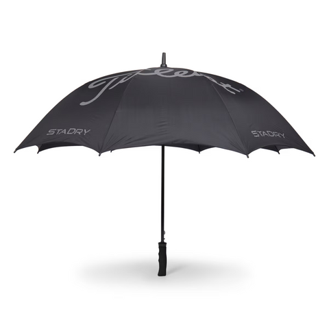 The Titleist StaDry Single Canopy Umbrella in black offers waterproof protection, featuring "Titleist" in white and "STADRY" on two lower panels—ideal for rainy golf days.