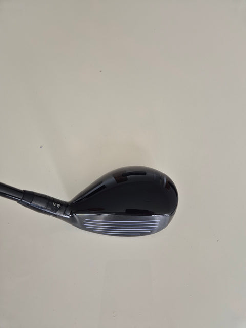 Crown and address view of Titleist TSR2 4 hybrid left-handed