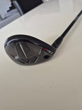 Angled sole view of Titleist TSR2 4 hybrid showing cosmetic wear