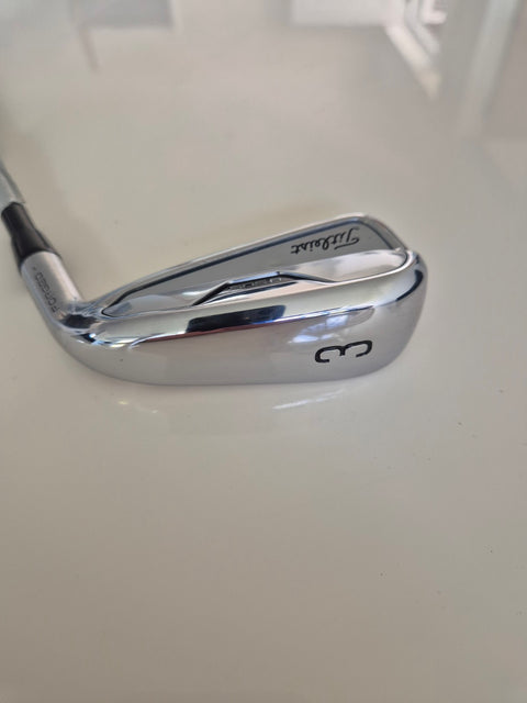 Sole of used Titleist U505 3 utility iron showing very light wear