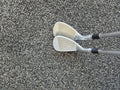 Angled face view of the used Titleist Vokey SM7 54 and 58 degree wedges