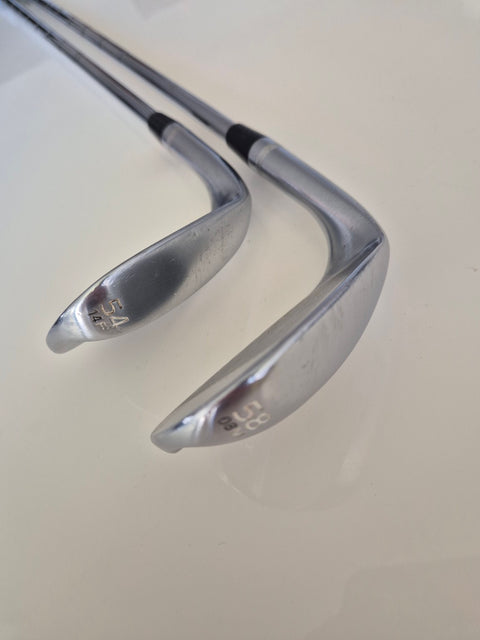 Soles of the actual Titleist Vokey SM7 54-14F and 58-08M wedges