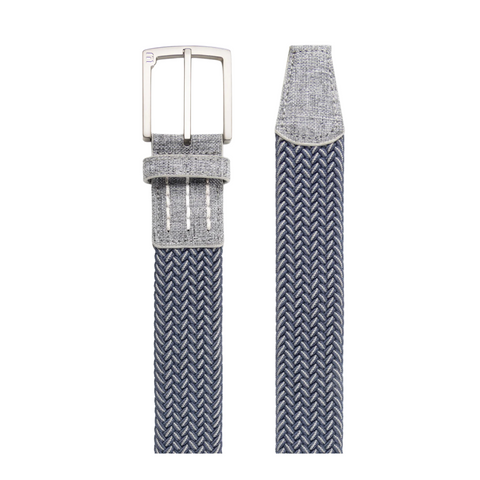 A close-up of the Travis Mathew Cheers 2.0 Stretch Woven Belt in dark blue/dark grey, featuring a textured braided design, flexible fit, matching fabric loop by the silver square buckle.