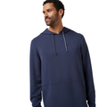 A man with short curly hair and a beard wears the TravisMathew Fibercloud Men's Hoodie in Total Eclipse, looking to his left against a plain white background.