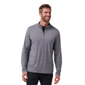 A smiling man with short light brown hair and a beard wears the TravisMathew The Heater Quarter Zip Mens Long Sleeve Polo in light gray and black pants, standing against a white background.