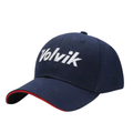 The Volvik Cap | Navy/White features white Volvik branding on the front and a red-edged brim, offering breathable comfort and standout style on the golf course.