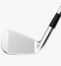 A close-up of a Wilson 2024 Staff Model CB Irons Set club head (4-PW) by Wilson, featuring its grooved face and a portion of the shaft against a plain white background.
