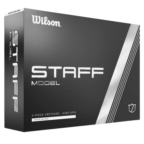 A black box of Wilson 2024 Staff Model Golf Balls features white text and silver stripes, showcasing 4-piece urethane construction for high-spin tour performance, with white/blanc on the front. Brand: Wilson.