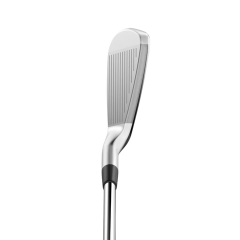 A close-up of the Wilson 2025 Dynapwr Max Women's Graphite Irons Set club head highlights its grooved face and sleek metallic finish against a white background.