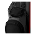 Close-up of the Wilson 2025 Feather Stand Bag by Wilson in black and gray, highlighting a walkers pocket with a partially open zipper, textured fabric, and several attachment loops and clips.