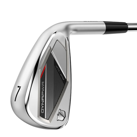 A close-up of the Wilson 2025 Men's Dynapwr Steel Irons Set (5-PW + GW) shows a sleek, modern 7-iron golf club with DYNAPWR branding, a forgiving cavity back, and a black, red, and silver clubface. The shaft is partially visible.