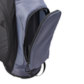 A close-up of the Wilson Exo Lite Stand Bag in Black/Charcoal shows its side compartment unzipped to reveal a spacious pocket, set against a white background.