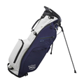 The Wilson Exo Lite Stand Bag | Navy/White by Wilson features multiple pockets, the WS logo, and convenient fold-out legs for upright support. This lightweight bag is perfect for golfers seeking style and functionality.