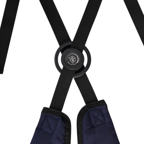 Close-up of black adjustable straps crossing through a round black connector, with stitched navy blue padding at the base of the lightweight Wilson Exo Lite Stand Bag | Navy/White by Wilson.