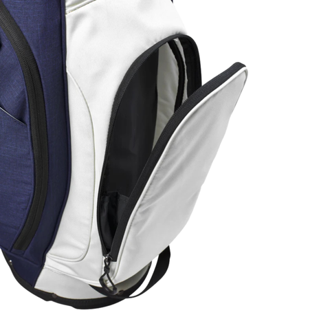 The Wilson Exo Lite Stand Bag in Navy/White by Wilson features a spacious inner pocket with a zippered compartment, ideal for walking golfers seeking a lightweight and convenient golf bag.