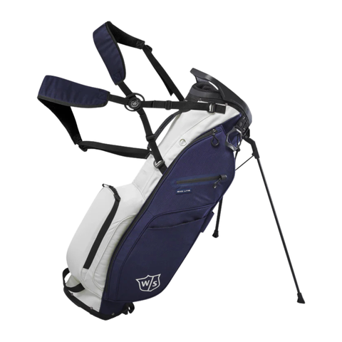 The Wilson Exo Lite Stand Bag in Navy/White features dual shoulder straps, extended stand legs, multiple zippered pockets, and a “WS” logo—offering a lightweight and functional option for every round.