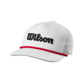 The Wilson Golf Rope Cap is a retro white cap with “Wilson” embroidered in black on the front, a red rope across the brim, and perforated side panels for breathability.