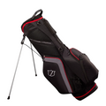 The Wilson Lite Stand Bag by Wilson, in Black/Charcoal/Red, features multiple zippered pockets, a side logo, an easy-carry handle, and silver legs with an automatic stand for upright support.