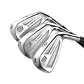 Three Wilson Men's Staff Model Utility Irons (prior generation) overlap in a row, showing numbers 24, 21, and 18 on their polished soles, each with black shafts and tungsten weighting for enhanced performance.