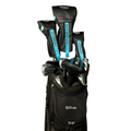 A black Wilson golf bag holds a Wilson Women's Dynapwr Golf Club Set with black and blue DynaPower headcovers, standing against a white background—ideal for golfers seeking forgiveness in a lightweight set.