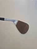 Callaway JAWS Raw 60 degree wedge face with natural rust and lightly used grooves
