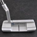 Used Odyssey White Hot OG 1WS 33 inch right-handed putter on charcoal workbench