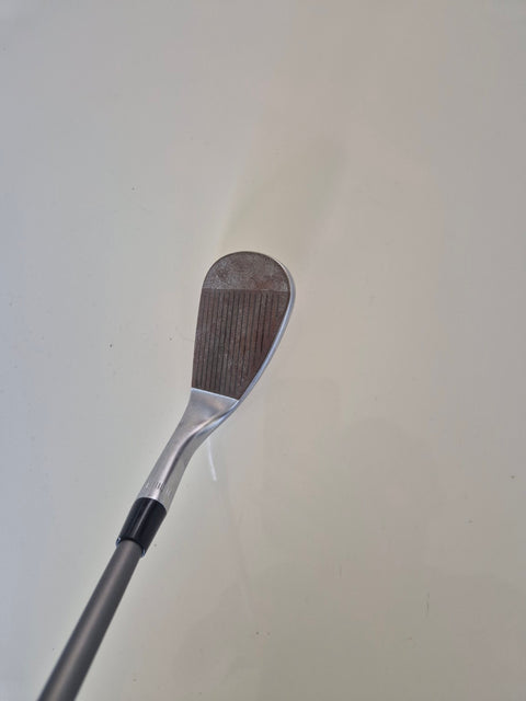 Angled view of the rusty raw face on the lightly used Callaway Jaws Raw wedge