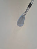 Angled view of the Callaway Opus wedge face showing cosmetic scratches