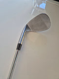 Face and grooves of the lightly used Callaway Opus 58 degree wedge showing shop-wear scratches