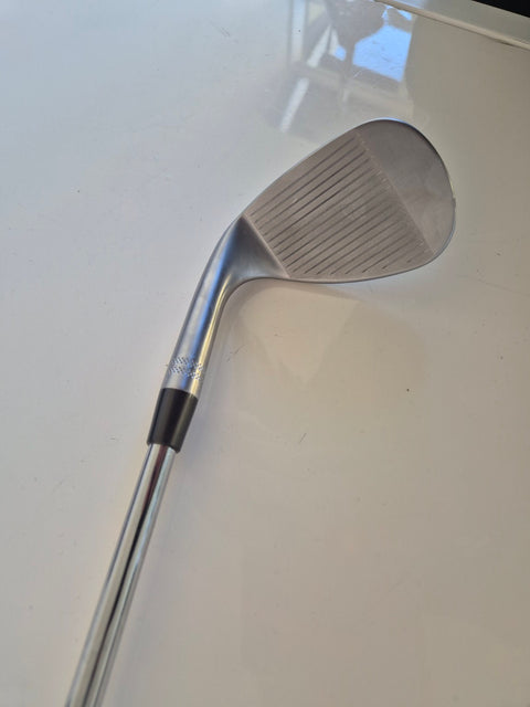 Face and grooves of the lightly used Callaway Opus 58 degree wedge showing shop-wear scratches