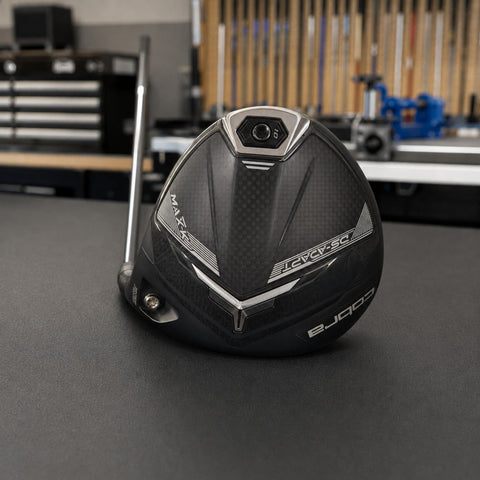 Used Cobra DS-ADAPT MAX-K 9 degree driver head on a Golf 360 workshop bench