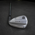 Used Wilson Staff Model 58 degree 10 bounce wedge on dark charcoal Golf 360 workshop workbench