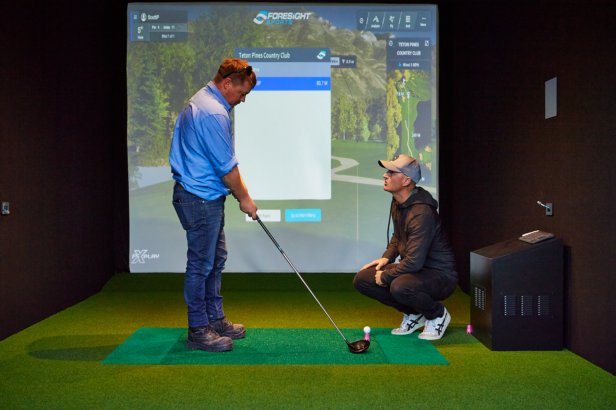 Swing analysis inside a golf simulator at Golf 360.